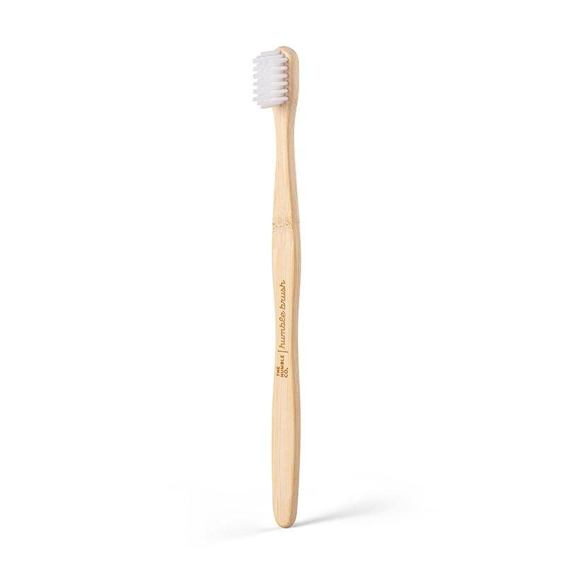 Bamboo toothbrush standing upright